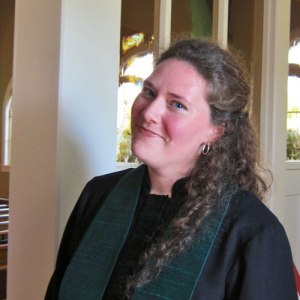 Amanda just got ordained and is about to greet folks on the way out of the service...