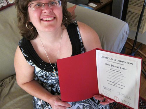Kelli beaming with ordination certificate finally in hand.