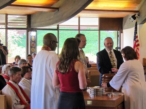 Kelli serving communion for the first time.