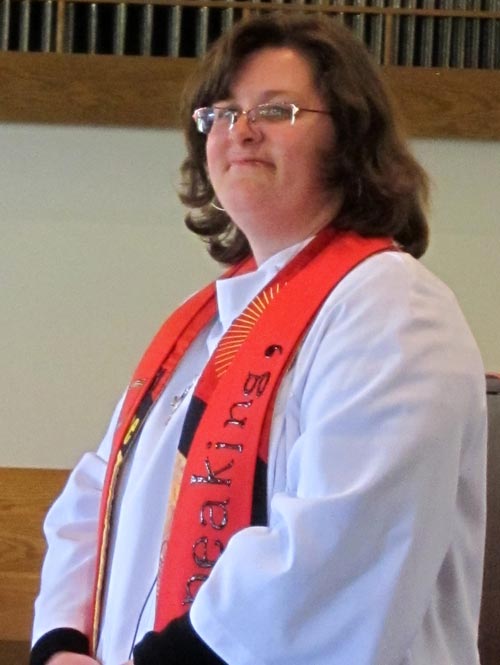 Kelli looking sharp with robe and stole.